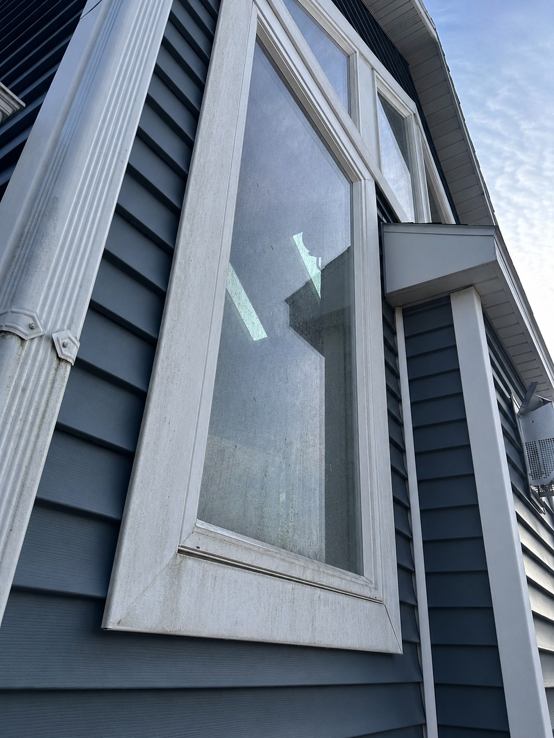 Upper south-facing window, before professional window cleaning